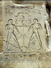 Base of a statue of Ramesses II in front of the temple at Luxor, depicting the god Hapy as a pair of genies symbolically tying together upper and lower Egypt