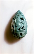 Amulet in the form of an openwork cowrie shell