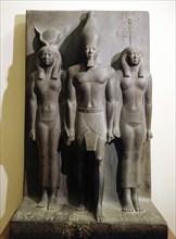 A group statue of King Mycerinus between the goddess Hathor and the personification of the nome of Hu or Diospolis Parva (the 17th nome or province of Upper Egypt)