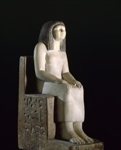 A statue of a seated woman, the royal acquaintance Nynefert min, the wife of an official