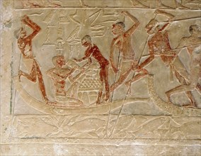 A relief from the tomb of the vizier Ptah hotep at Saqqara of a scene of a crew on papyrus rafts returning from a fowling expedition