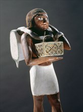 Wooden statuette of a bearer from the tomb of Niankhpepi, supervisor of Upper Egypt, chancellor of the king of lower Egypt, at Meir