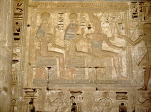 The pharaoh Ramesses III offering to the god Osiris and the goddesses Isis and Hathor