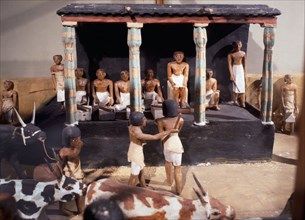 Wooden model depicting the tomb owner Meketre and his son, assisted by scribes and herdsmen, inspecting and counting his livestock