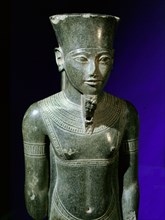 Statuette of the God Amun found in the court of the temple of Amun at Karnak with the facial features of Tutankhamun