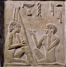 A relief on the false door of Nikaure showing two women singing and playing the harp