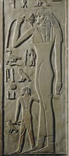 A relief on the false door of Nikaure who was a priest of the god Ra and the goddess Hathor in the sun temple of King Neferirkare