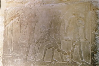 A relief in the tomb of Princess Sesh seshet at Saqqara showing statues being dragged on sleds from the workshops to the tombs