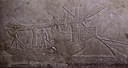A limestone relief from the tomb of Ipi depicting a boat with its sail furled and carrying a huge block of stone
