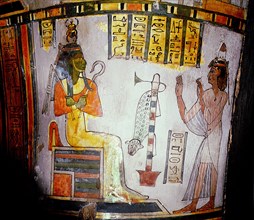 Detail from a coffin: the deceased pleading before Osiris