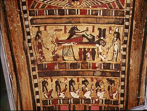 Detail of painted scarcophagus lid, showing the jackel headed Anubis attending the mummified corpse of the deceased