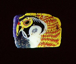 Glass fragment with falcon head