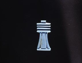 Blue glass furniture inlay depicting a djed(stability)pillar which by the New Kingdom was regarded as a symbol of Osiris