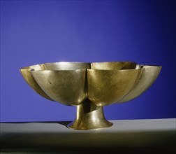 Stemmed drinking bowl in the shape of a lotus flower, the petals made alternately of gold and electrum