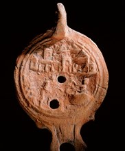 Oil lamp with schematized view of the harbour of Alexandria where the tombs of Alexander the Great, Antony and Cleopatra and the mausoleum of Augustus were erected