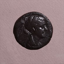 A coin with the head of Cleopatra
