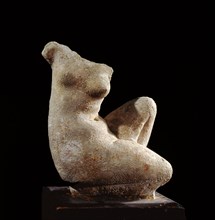 Torso of a statue of a kneeling woman, probably a copy of a bathing Aphrodite