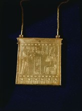 Gold pectoral on chain, from the tomb of Amenemope, showing the king offering incense to the enthroned Osiris