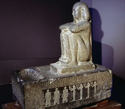 Block statue of Djedher, a fourth century official and sage, in the form of a temple guard