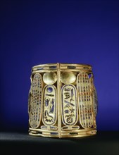 Gold  bracelet  from  the tomb of Amenemope mounted with a lapis lazuli scarab bearing aloft the gold solar disc