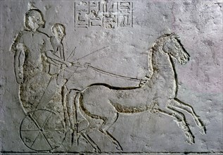 A relief in an Amarna tomb showing soldiers on a battle chariot