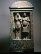 A stela with figures of the sculptor Bak with his wife, Tahere