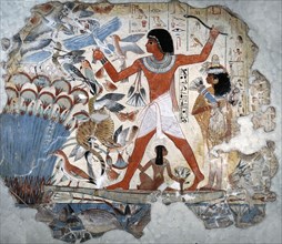 A painting from the tomb of Nebamun showing him standing on a reed boat hunting birds in the papyrus marshes using throwsticks and three decoy herons