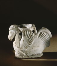 Unusual ointment container in the form of a bird with a horses head