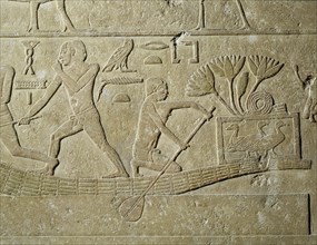 A relief depicting hunters in papyrus reed boats with captured birds in baskets