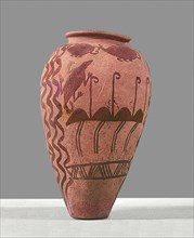 An urn decorated with a design of stylised ostriches
