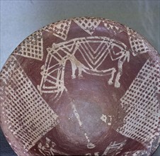 A dish with a design of stylised hippopotami