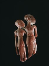 Moulded red glass figures considered to be Amarna princesses