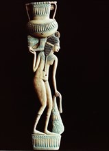 A cosmetic spoon in the form of a naked young woman carrying an amphora on her shoulder and a bag