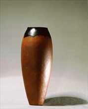 Tall pottery vessel with curved sides