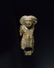 Small ivory statuette in the form of a female dwarf with a massive wig