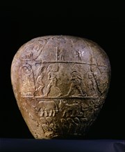 The completely preserved votive mace   head of Narmer is decorated with scenes in relief, arranged in registers