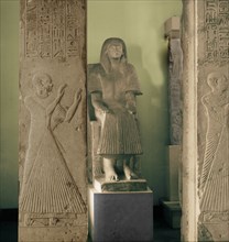 Limestone statue and two pillars with reliefs of adorants from the tomb of Ptahmose, priest in the temple of Ptah