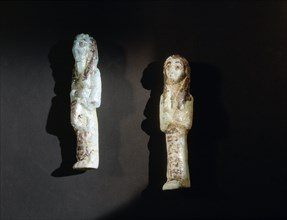 A faience shabti and overseer shabti from the burial of King Siamun