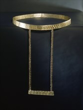 Gold and silver alloy belt with fastening at rear and attached apron frame