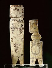Two Coptic bone dolls of schematic flat peg form with incised circle decoration