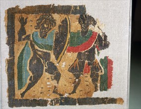 Textile with design of warriors fighting