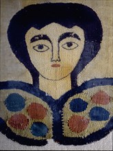 Coptic textile with a design of a female head