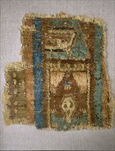 Fragment of a Coptic carpet depicting a person praying in a small room
