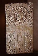 Early Christian stela incorporating a looped cross (crux ansata) or ankh symbol, surrounded by the vine of eternal life, illustrating the fusion of pharaonic iconography with Christian motifs in Byzan...