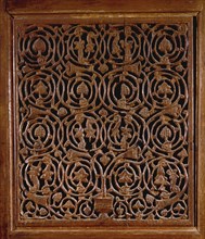 Detail of a door with vines and foliage decoration