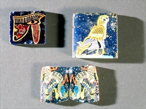 Glass furniture inlays depicting the eye of Horus, a falcon, and a pair of lapwings