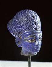 Miniature blue glass paste head of the pharaoh Amenophis III, wearing the blue war crown