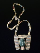 Winged scarab pectoral on bead chain, from the tomb of Psusennes I