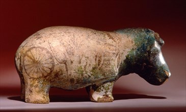Statuette of hippopotamus from a burial, with depictions of marsh plants on his body