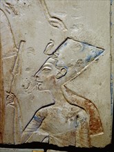 Sunk relief from the facade of a shrine showing Akhenaten and Nefertiti offering libations to Aten, the sun god